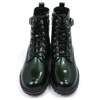 Pair of patent green combat boots with black laces on a white background