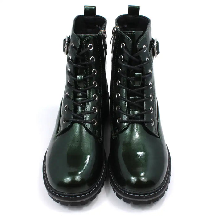 Pair of patent green combat boots with black laces on a white background
