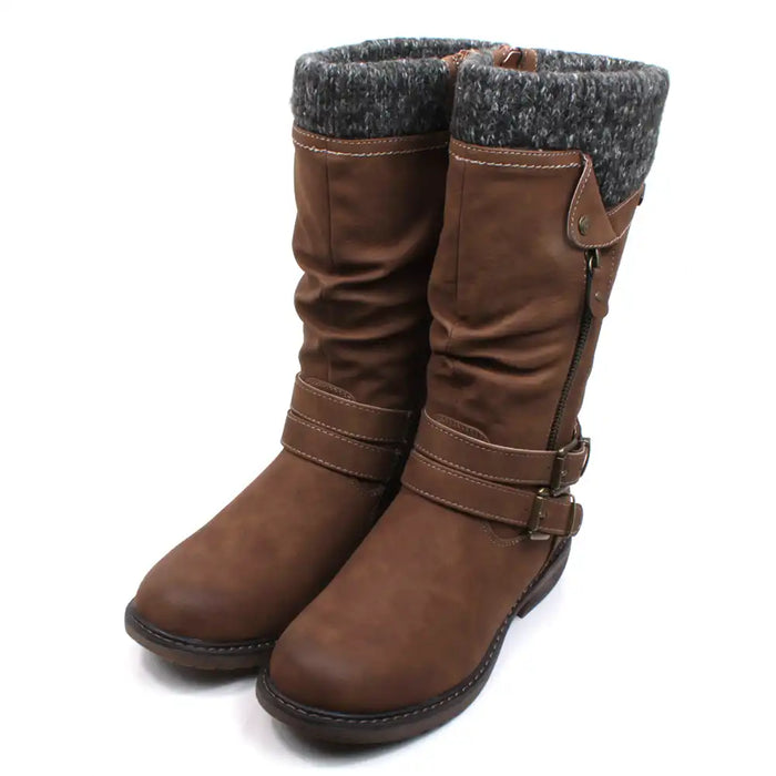 Lunar Peyton tall boots in tan with straps, buckles and zips details. Low heels. Grey knitted cuffs around the leg openings. Angled view.