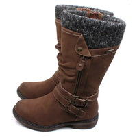 Lunar Peyton tall boots in tan with straps, buckles and zips details. Low heels. Grey knitted cuffs around the leg openings. Side view.