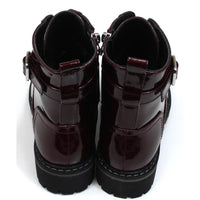 Lunar urban boots in patent burgundy. Front seven eye lacing. Zip up fitting. Black rugged soles. Back view.