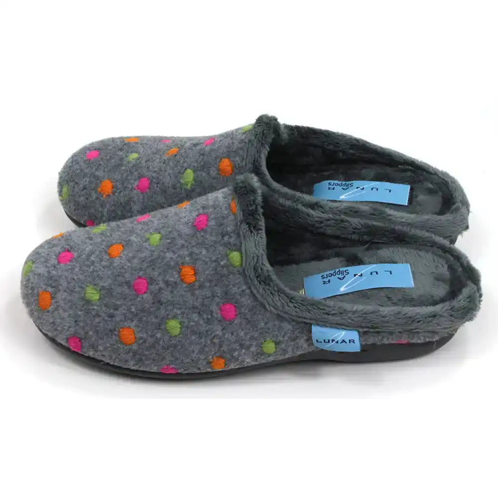 Lunar brand, grey mule slippers with orange, pink and green spots. Grey fur inside. Side view.