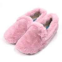 Pair of pink fuzzy slippers on a white background