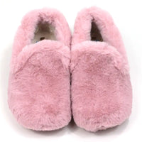 Pair of pink fuzzy slippers on a white background
