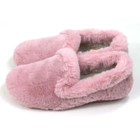 Pink fuzzy slippers on a white background
