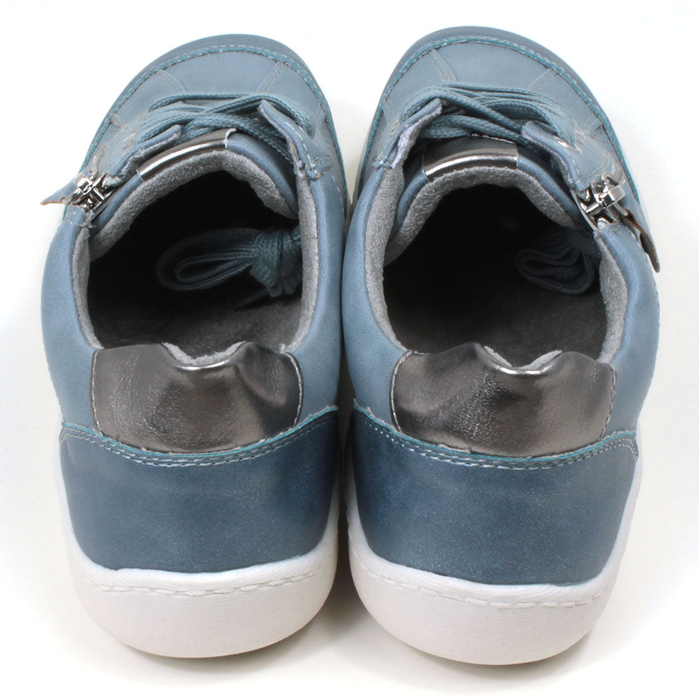 Mid blue trainers with white soles. Matching laces for adjustment and side zip for fitting. Silver detailing on the tongue and at the heels. Back view.