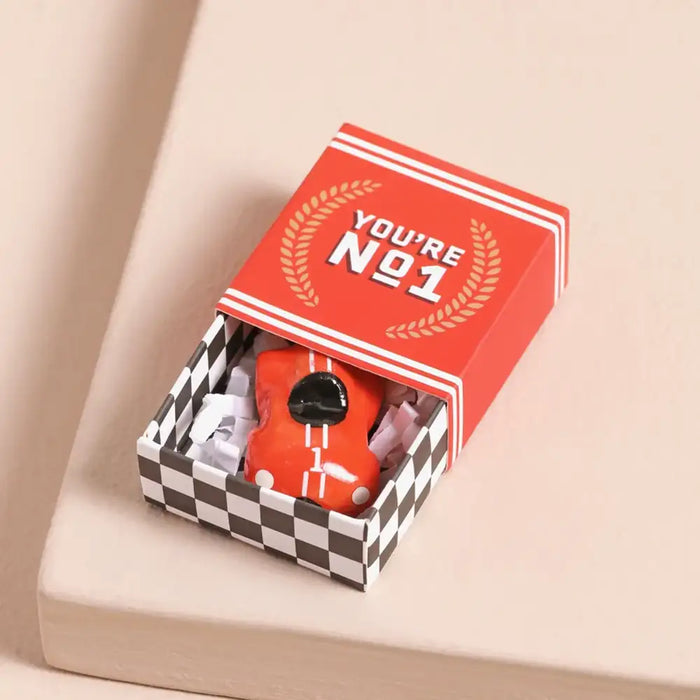 Red object in a checkered box with 'You're No. 1' text on a beige background