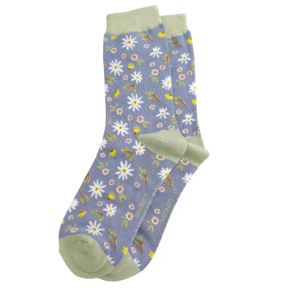 Floral patterned socks with green accents on a white background