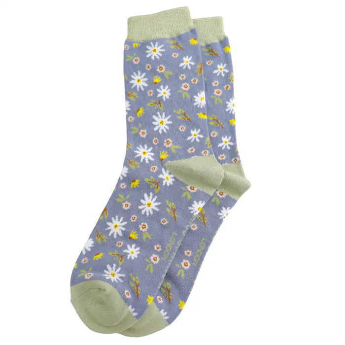 Floral patterned socks with green accents on a white background