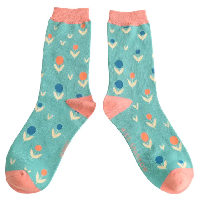 Womens ankle socks in duck egg blue with pastel flower buds.