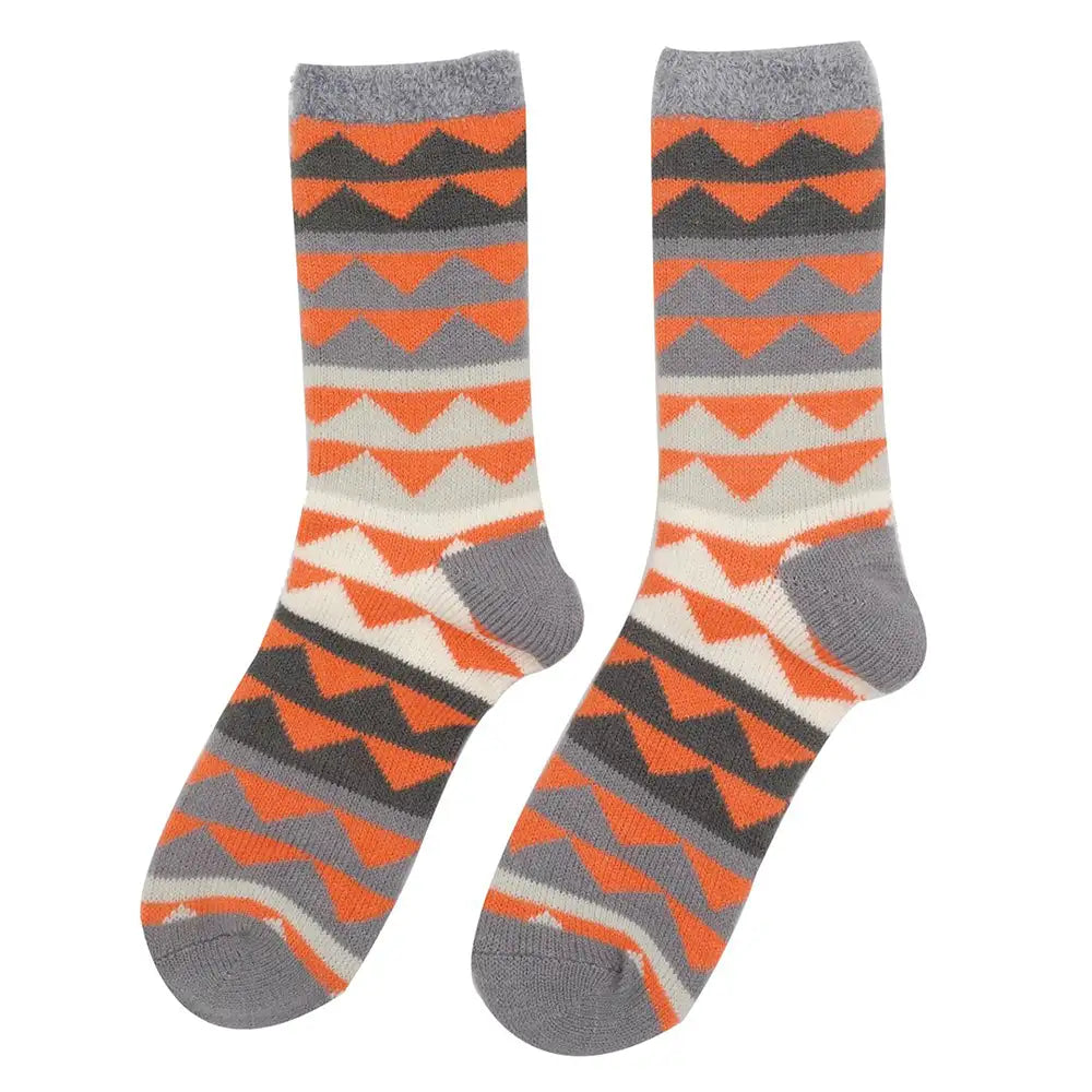 Pair of socks with orange and gray geometric pattern on a white background