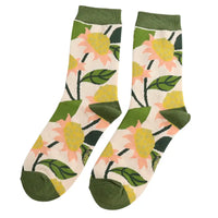 Floral-patterned socks with green accents on a white background