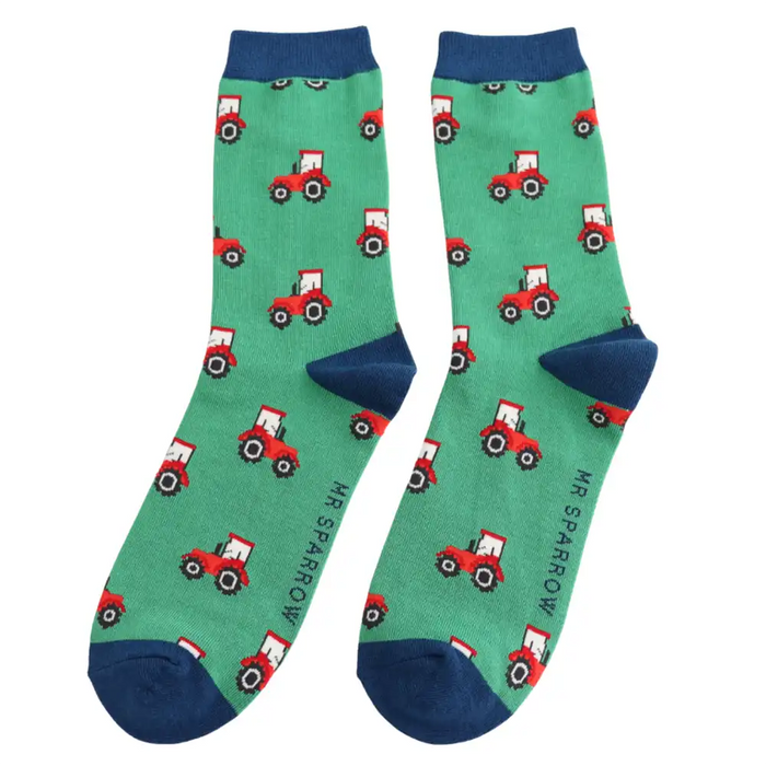 Green socks with red tractor pattern and blue toes, heels and  cuffs on a white background.