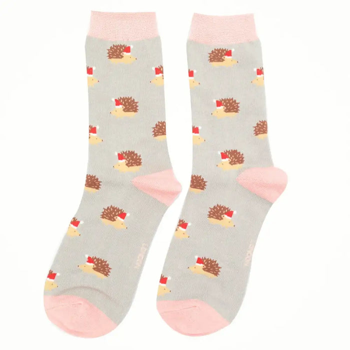 Gray socks with hedgehog pattern and pink toes on a white background