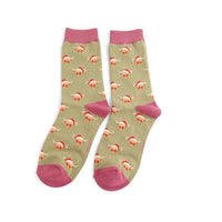 Pair of socks with dinosaur pattern and pink accents on a white background