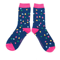 Pair of blue socks with colorful light bulb pattern and pink accents on a white background