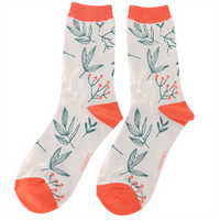 Pair of socks with leaf pattern and orange accents on a white background