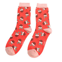 Red based socks with brown Christmas Puddings on. Pale pink ankle cuff, heel and toe. 