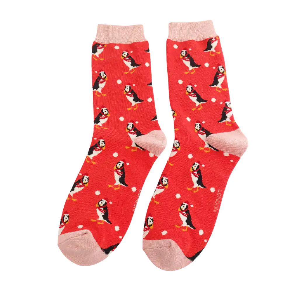 Red socks with puffin pattern on a white background