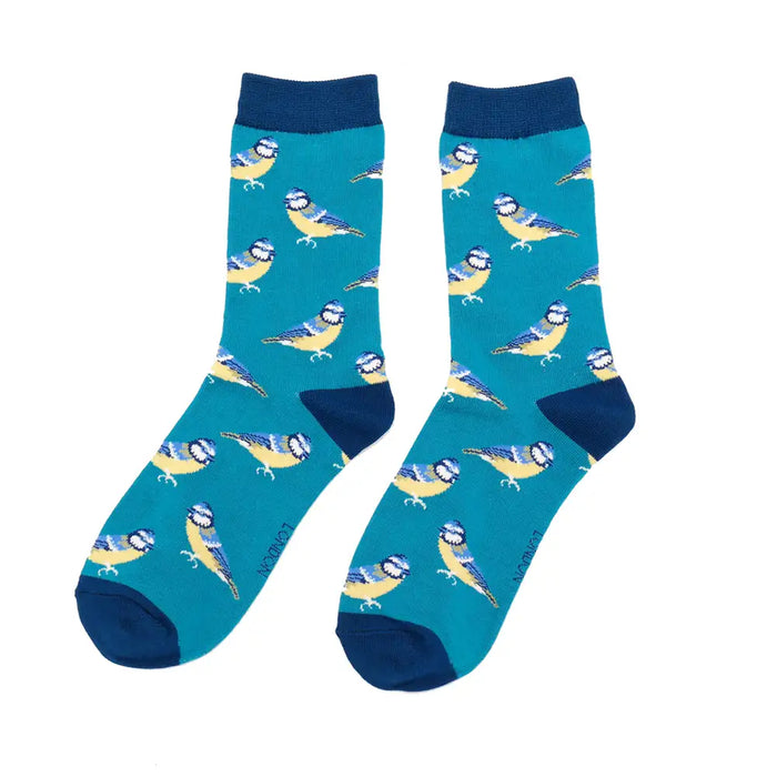 Pair of socks with bluetit bird pattern on a teal blue background