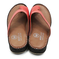 Pair of sandals with pink straps and brown soles on a white background