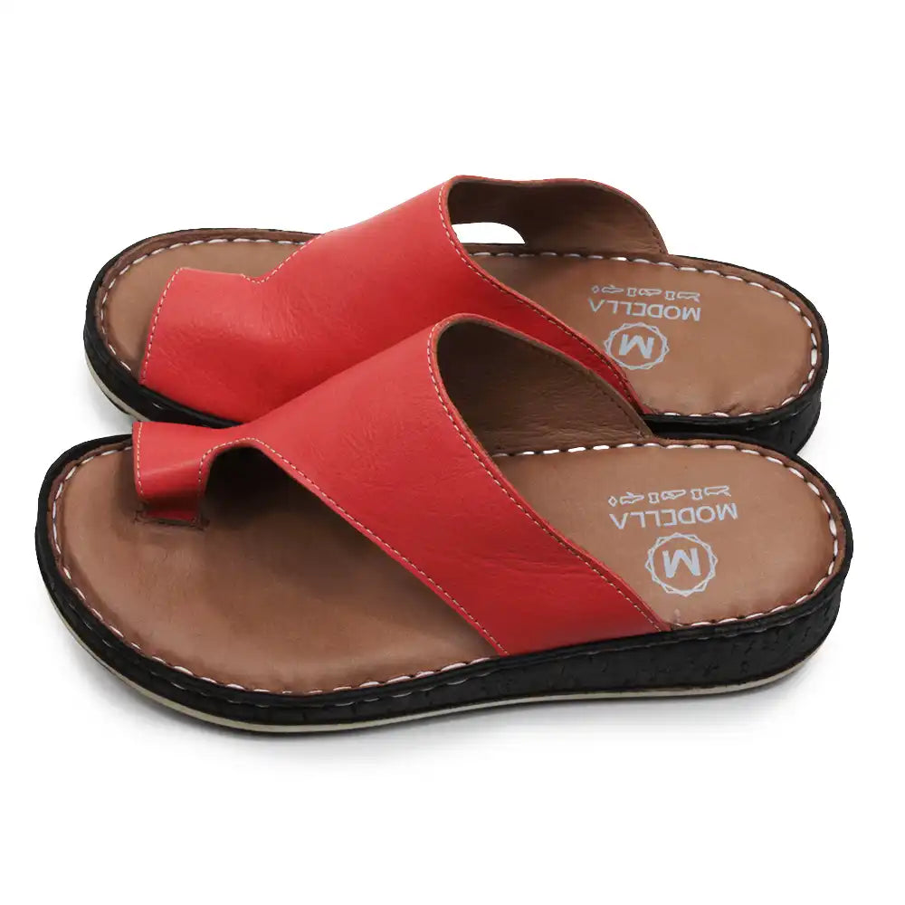 Red sandals with brown soles on a white background