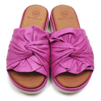 Pink sandals with a knotted design on a white background