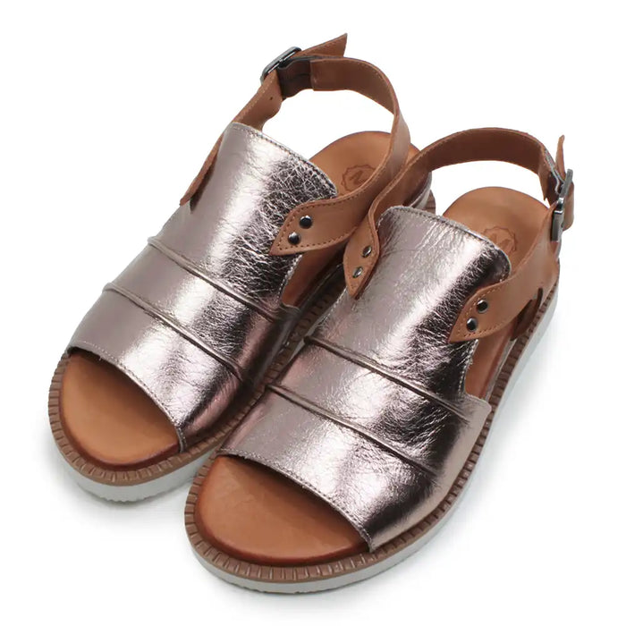 Pair of metallic bronze sandals with brown straps on a white background