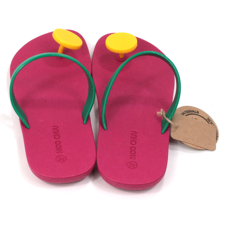 Slider sandals with bright cerise soles, green over the foot strap and large bright yellow 'dot' toe posts. All made from recycled rubber. Back view.