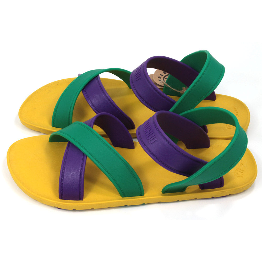 Sling back sandals with bright yellow soles and purple and green straps. All made from recycled rubber. Side view.
