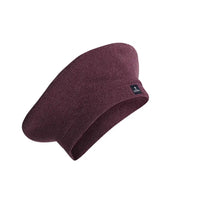 Maroon knit beanie with a brand logo on a white background