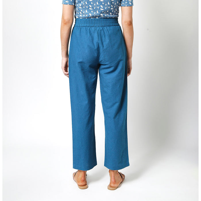 Mudd and Water Teal ankle grazer trousers. Pockets and elasticated waist. Back view.