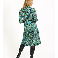 Woman wearing a floral dress with a white background