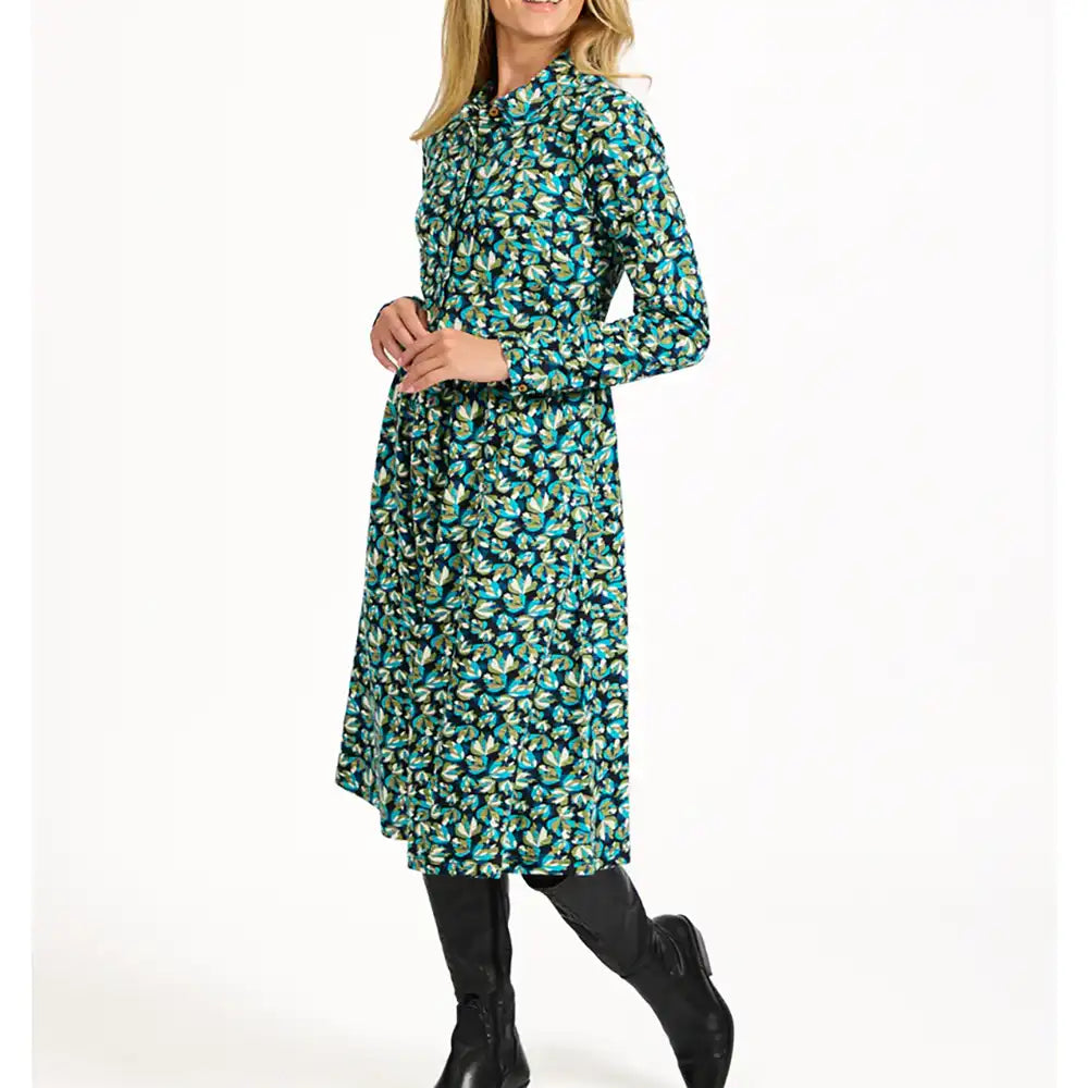 Woman wearing a floral dress on a white background