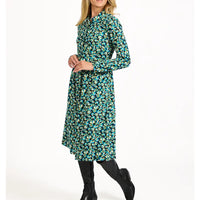 Woman wearing a floral dress on a white background