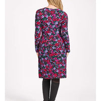 Floral patterned dress worn by a person on a white background