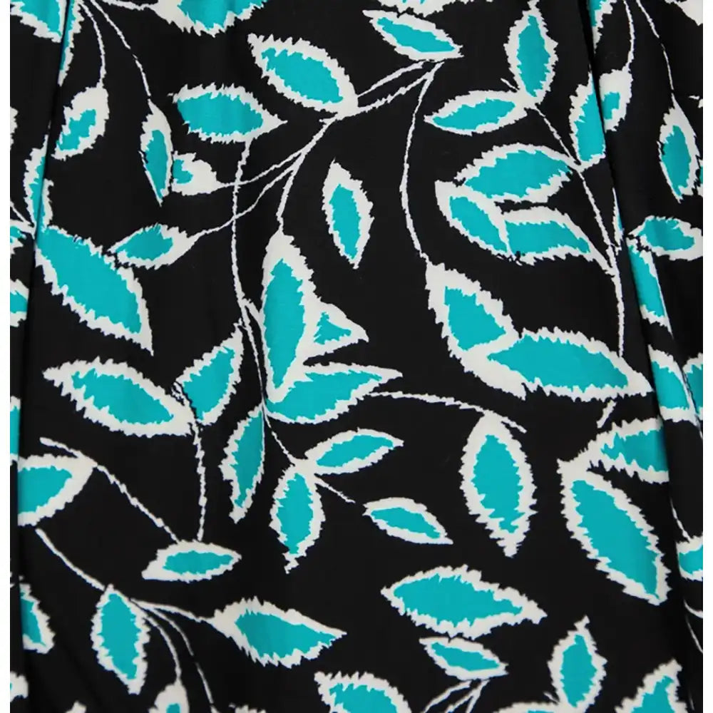 Black fabric with a repeating pattern of turquoise and white leaves and stems.