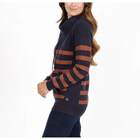 A woman wearing a navy blue ribbed knit cowl-neck sweater with rust-brown horizontal stripes on the sleeves and body, paired with dark pants, shown against a plain white background.