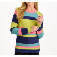 A woman wearing a colorful striped knit sweater with horizontal bands of navy, teal, lime green, and pink on a plain white background.