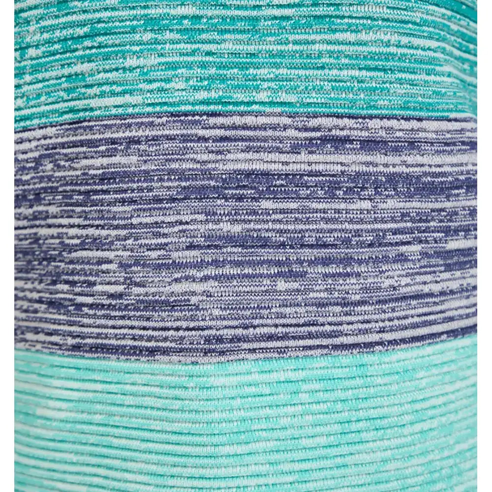 Close-up of a striped knit fabric with horizontal bands of mint green, dark purple, and white.