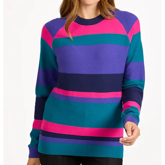 A woman wearing a long-sleeve crewneck sweater with bold horizontal stripes in purple, teal, and hot pink, shown against a plain white background.