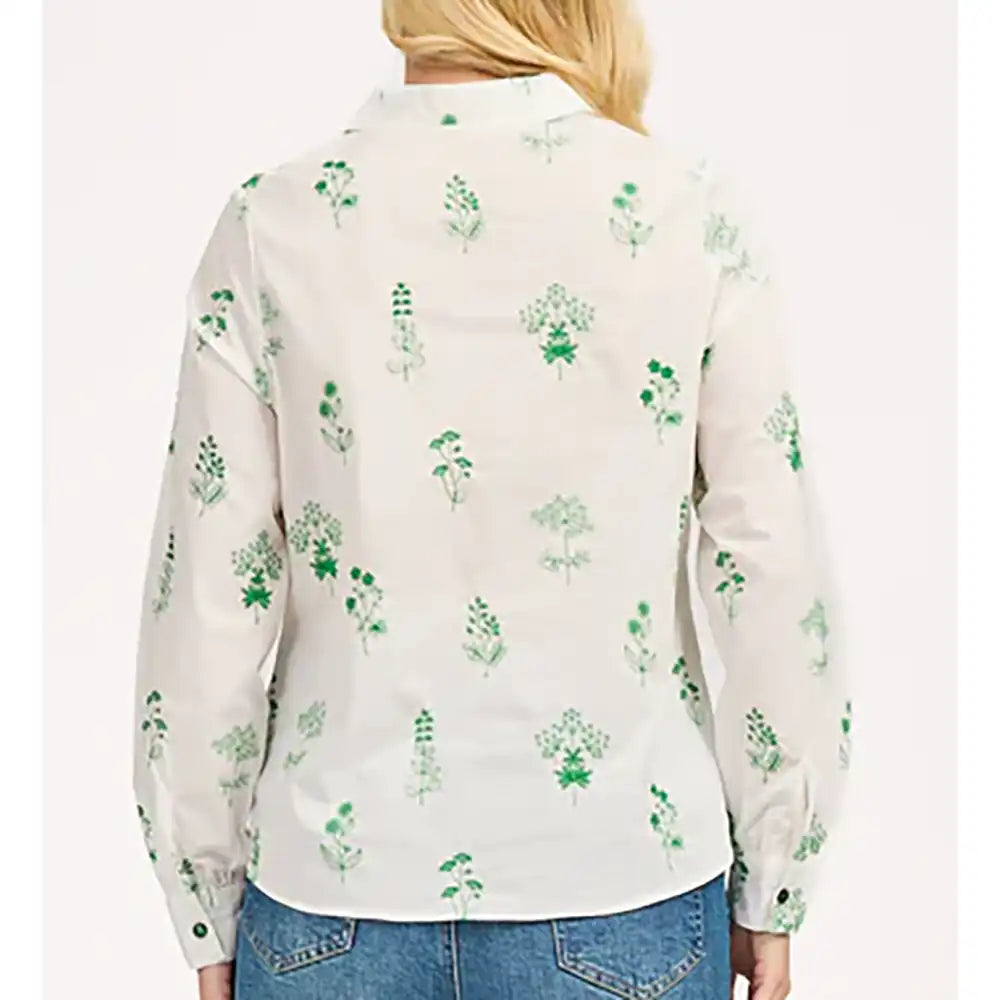 Back of a long sleeve white shirt. Green floral embroidery all over. 