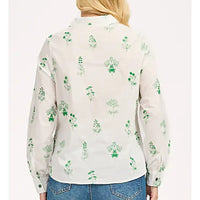 Back of a long sleeve white shirt. Green floral embroidery all over. 