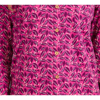 A close-up of a pink button-up shirt with a magenta and purple leaf pattern, featuring gold buttons down the front.