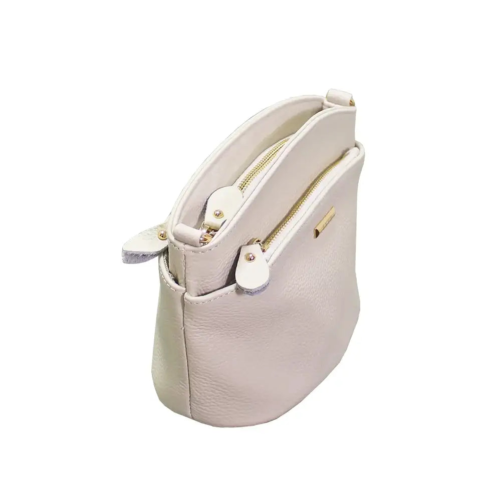 Light gray handbag with gold zipper on a white background