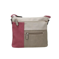 Crossbody bag with pink and beige sections on a white background