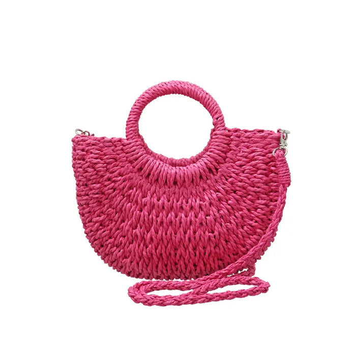 Fuchsia pink straw bag with a rounded straw covered handle . 