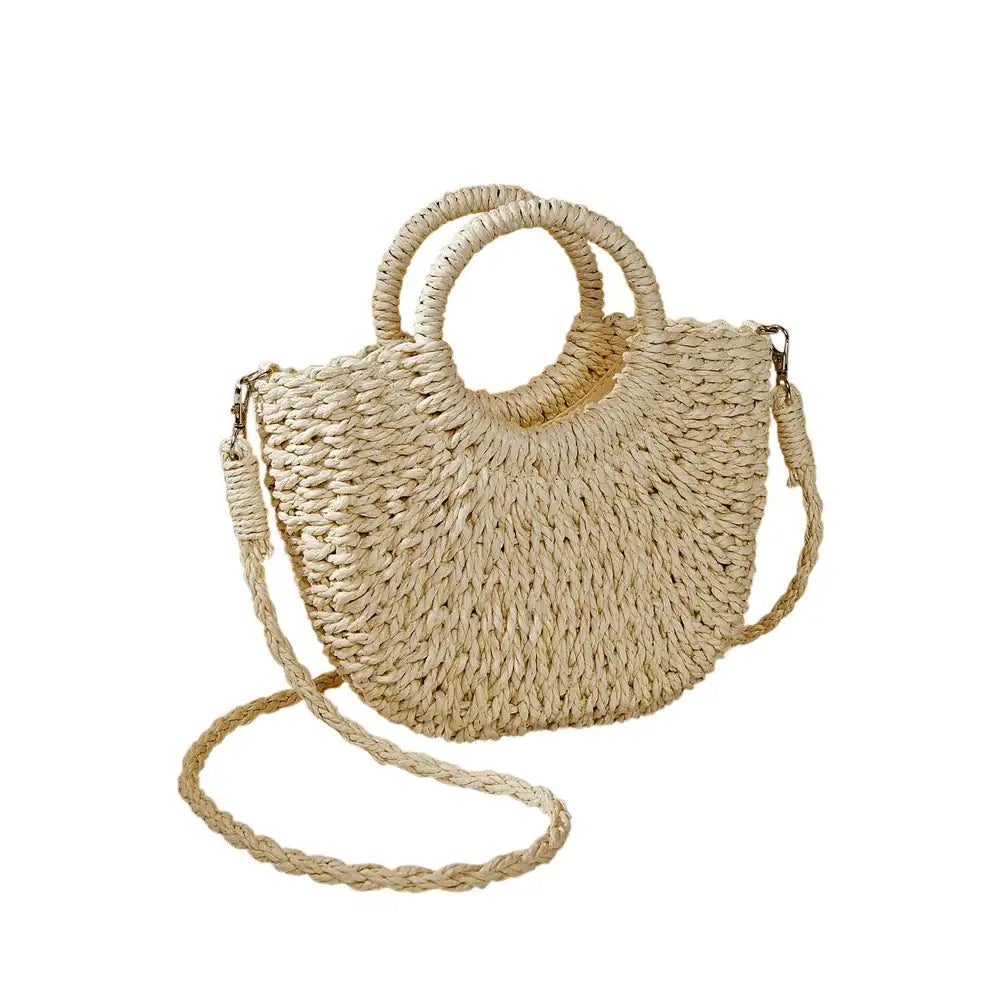 Beige straw bag with a rounded straw covered handle . 