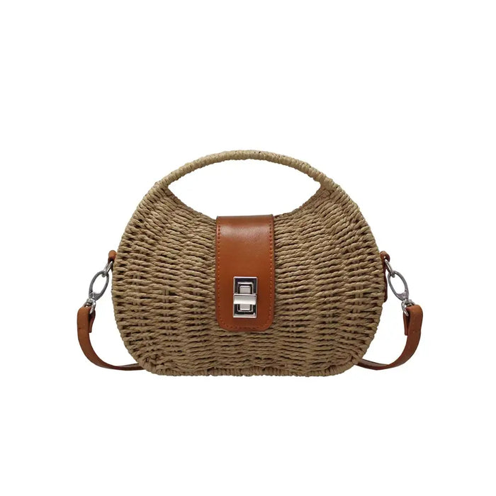 Woven handbag with a brown strap and leather patch on a white background