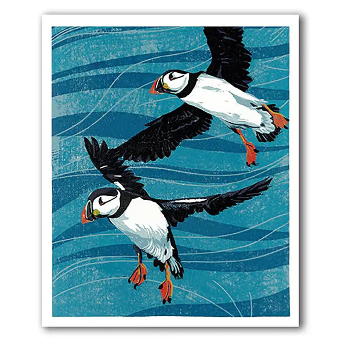 Two puffins flying against a blue wave background